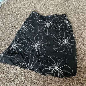 Ann Taylor size 2, black mini skirt with white floral embroidery
